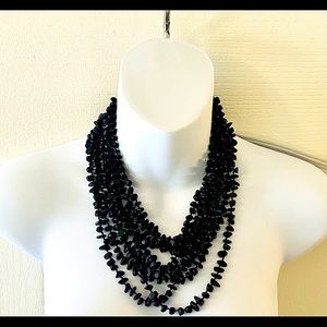 Multi tiered faux Black Onyx necklace.